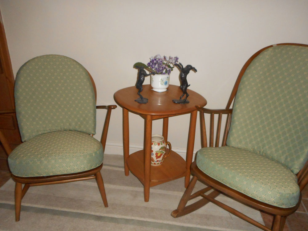 An Ercol armchair has been transformed by creating new cushions witha contemporary patterned fabric